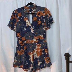 Orange & blue romper with choker neck & open back